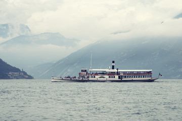 Ancient paddle wheel boat, vintage film, cross processing filter applied.