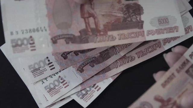 Rouble. Money. Bill 5000. Counting money.