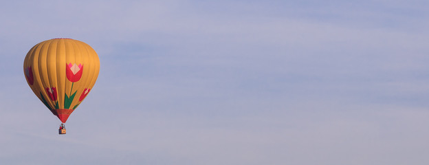 Fototapeta premium Colorful hot-air balloon flying in the sky