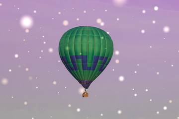 Colorful hot-air balloon flying in the sky, with fairies effect