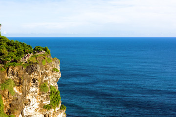 blue sky and deep sea with high cliffs