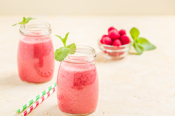 Raspberry smoothie close up photography with fresh summer blended cocktail and ripe berries.