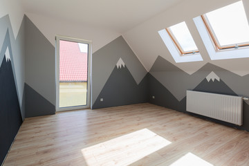 Kids bedroom with mountains paint and new laminated floor