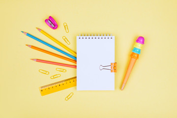 School accessories on a yellow background.
