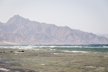 Red sea with mountains on background, Dahab, Egypt