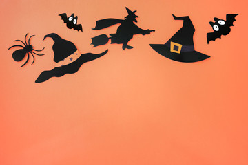 Halloween black paper decorations with orange background
