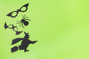 Halloween black paper decorations with green background
