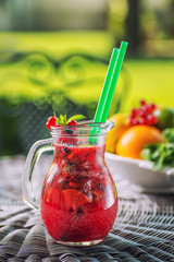 fresh red lemonade with mint leaf in glass , strawberry, red currant, apple or beetroot fruit drink, product photography for healthy lifestyle