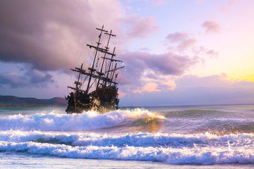 Old ship silhouette in sunset scenery, Italy