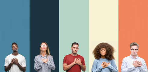 Group of people over vintage colors background smiling with hands on chest with closed eyes and grateful gesture on face. Health concept.