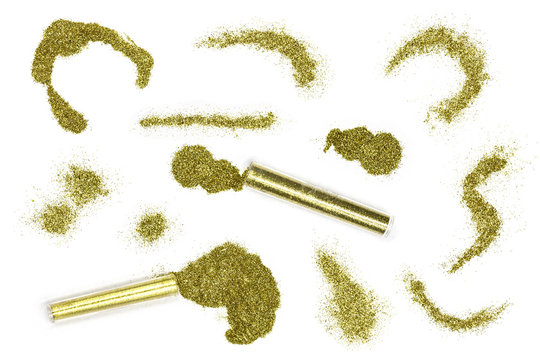 Yellow Gold Glitter Blots On White Background. Gold Powder Decor Elements Isolated. Cosmetic Gold Shimmer Top View Photo