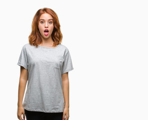 Obraz premium Young beautiful woman over isolated background afraid and shocked with surprise expression, fear and excited face.