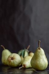 Fototapeta na wymiar Ripe pears on dark background