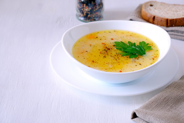 bowls of vegetable soup puree with cheese and seasonings, copy space
