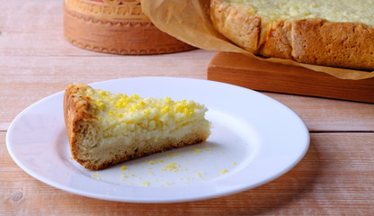 Homemade cottage cheese cake on wood background. 