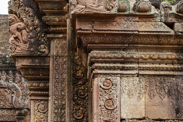 Stone carved bas-relief of Banteay Srei temple in Angkor Wat, Cambodia. Traditional bas-relief on cambodian hindu temple