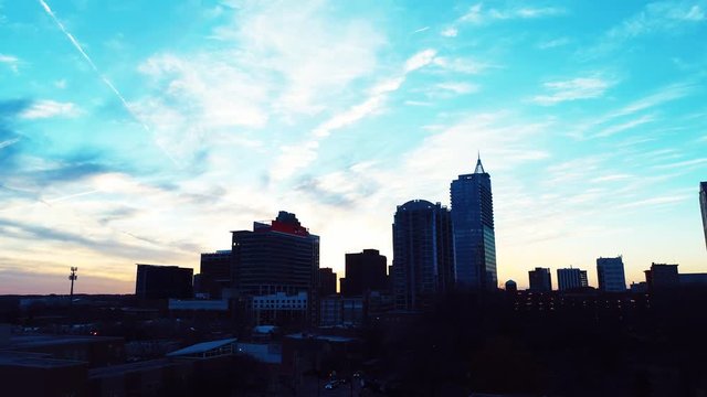 Low angle aerial, sunset over Raleigh