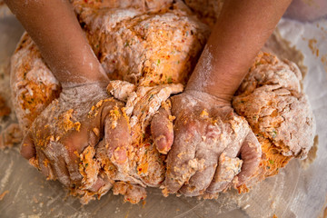 Turkish women preparing Tarhana. Tarhana is a Turkish soup made from a fermented and dehydrated mix of flour, yogurt, onions, tomatoes and green peppers. 