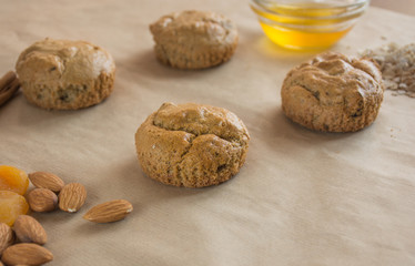 Healthy oatmeal cookies with ingredients on beige background