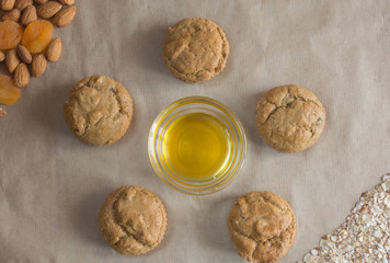 Healthy oatmeal cookies around the bowl with honey