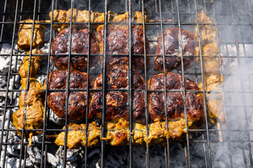 Braai barbecue with smoke rising form the coals