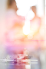 Beautiful woman face near doctor with syringe.