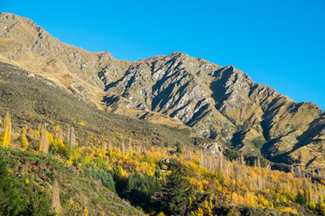 Scenic view of mountains, autumn landscape with colorful hills at sunny day