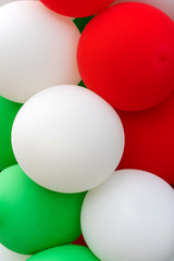 Many colorful balloons decorated wall as background