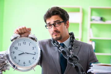 Employee chained to his desk due to workload