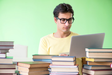 Student with too many books to read before exam