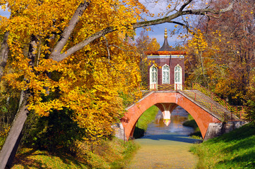 Cross bridge in golden fall in Alexander park, Pushkin, Saint Petersburg, Russia