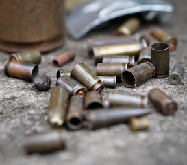 Sleeve from the gun on the background of a concrete structure. Military and hunting subjects for...