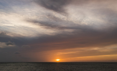 Naklejka na ściany i meble Sunset on a west coast sail Curacao Views in the caribbean
