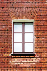 Fototapeta na wymiar an image of old window on red brick wall