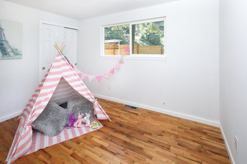 Neat kids room with wigwam playing house © Javani LLC
