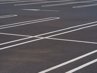 asphalt surface of car parking slot with white line stripe