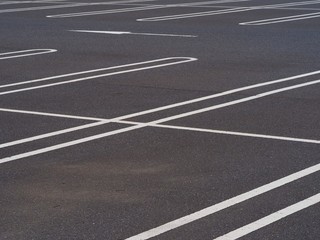 asphalt surface of car parking slot with white line stripe © oasisoasis