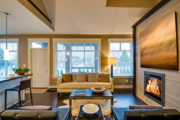 Modern bright living room  with fireplace and sitting area. Interior design.