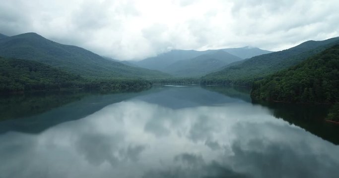 Reflective lake in North Carolina, wide aerial