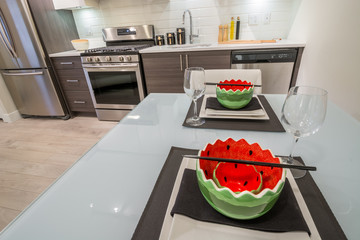 Modern bright kitchen with a dinner table. Interior design.