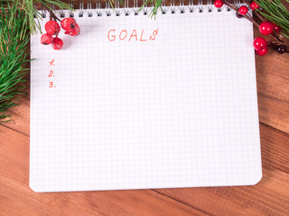goals for new year in blank open notebook