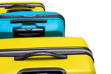 background. colored travel suitcases. yellow / blue