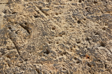 Texture old wall. Surface of an ancient temple in Prague. Background of stone for the designer. Vintage pattern in brown tones