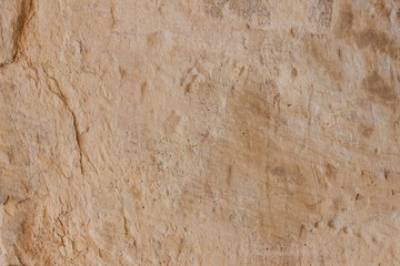 Texture old wall. Surface of an ancient temple in Prague. Background of stone for the designer. Vintage pattern in brown tones