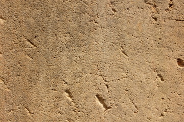 Texture old wall. Surface of an ancient temple in Prague. Background of stone for the designer. Vintage pattern in brown tones
