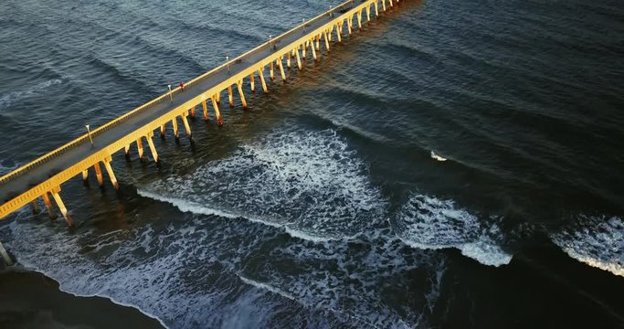 Tilt up aerial, coastal pier in Wilmington