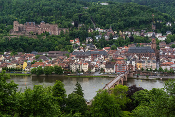 Fototapeta na wymiar City of Heildelberg with the amazing bridge and the castle on the top of the hill