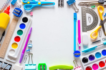 back to school concept. school supplies and place for text on a white background