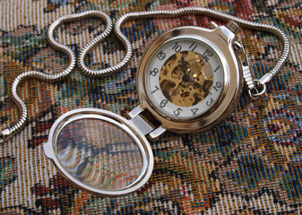 vintage pocket watch over vintage design fabric