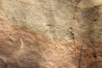 Granite texture. Granite stone close up. Background of natural material. Rocky rocks of ancient times. Natural pattern
